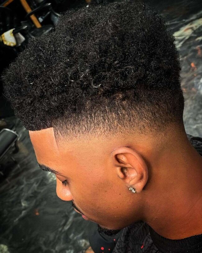 High top fade hairstyle with defined edges for Black men