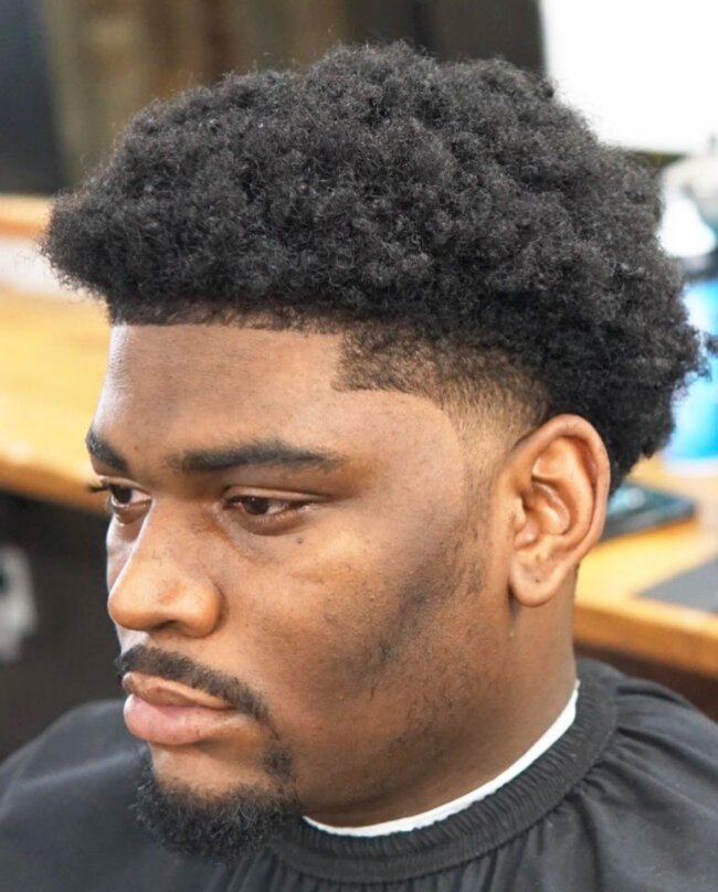 Taper fade with short waves hairstyle for Black men