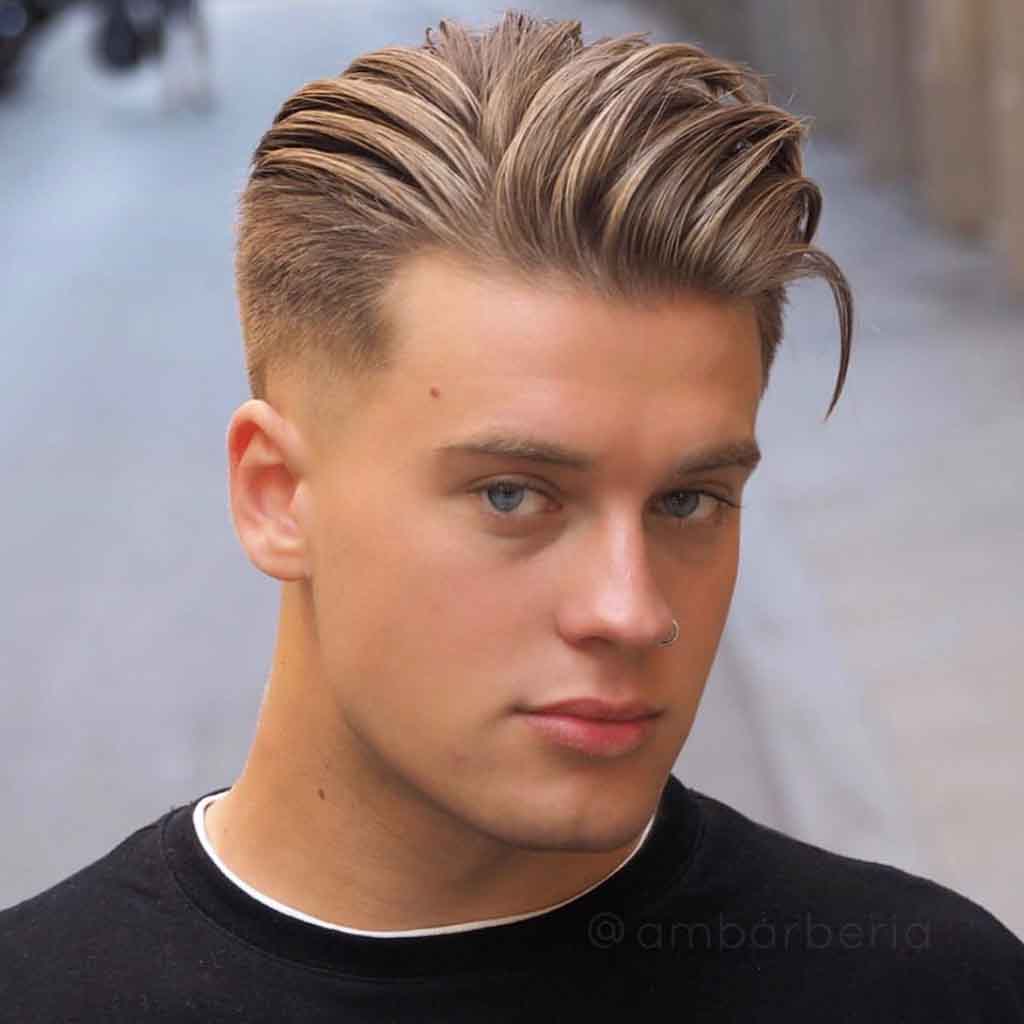 Sleek pompadour with a taper fade for a refined yet stylish streetwear look