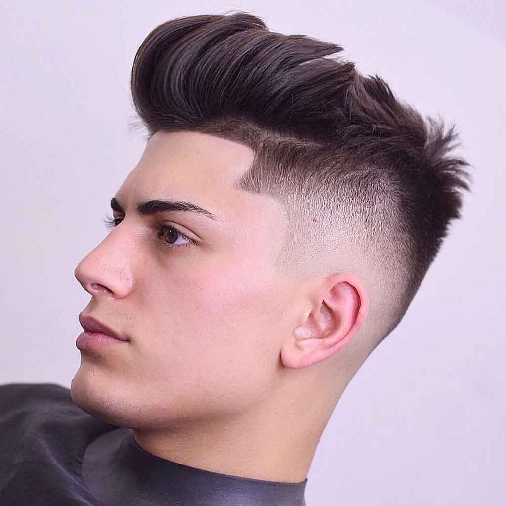 Side-swept bangs with tapered sides for a sleek and edgy streetwear vibe