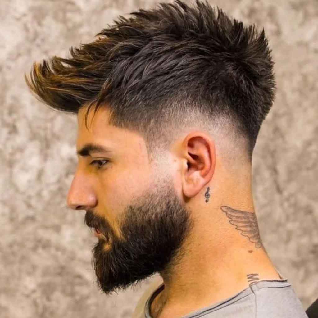 Sharp fade matched with angular afro top for a bold and defined look