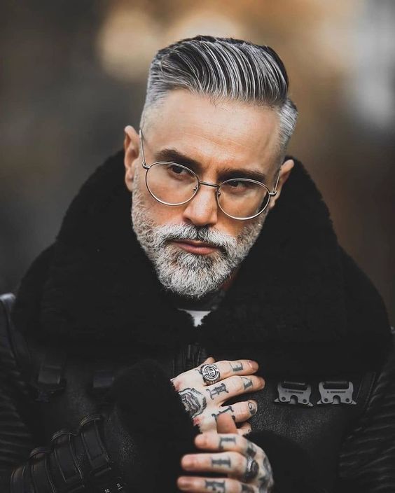 Gray-bearded man in dark turtleneck sweater