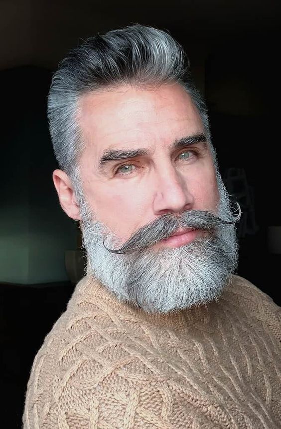 Casual gray-bearded man with knitwear